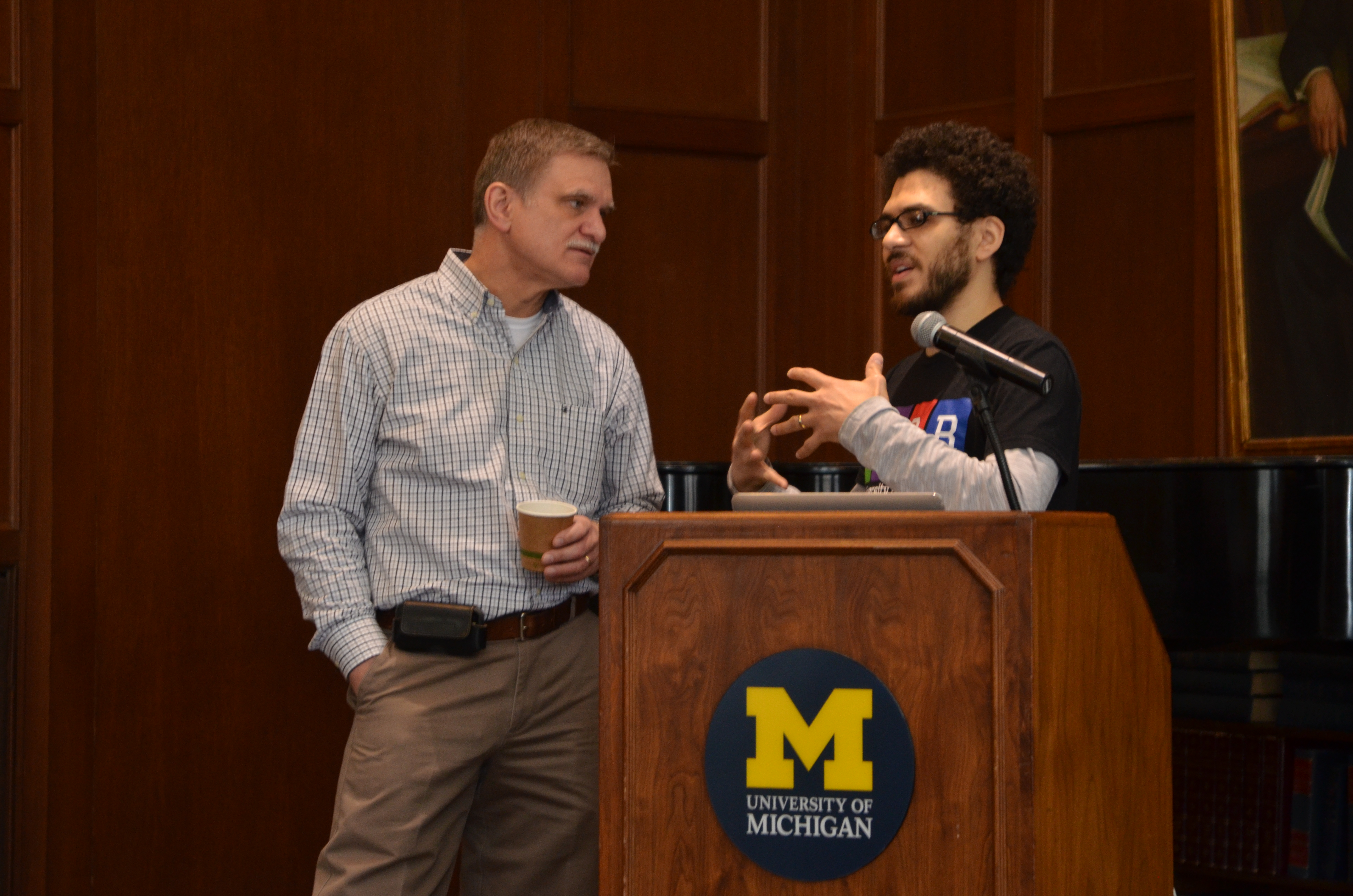 Michael Medina, president of Students of Color of Rackham, chats with U-M Police Chief Robert Neumann.