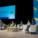 panelists on a stage talking