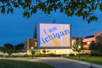 LED sign on exterior building displaying "I am Michigan"