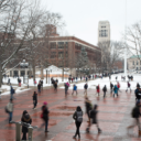 students walking across campus near Burton Tower